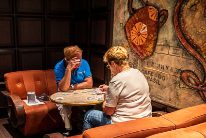 Couple playing cards on MSC PREZIOSA