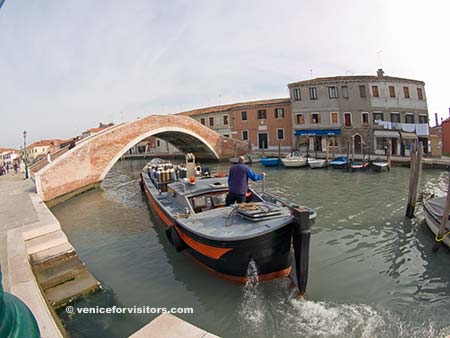 Canal, barge, and bridge on Murano